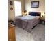 Bedroom with a plush bed, complemented by side tables and stylish lighting, creates a cozy and inviting space at 9454 Tanhurst Dr, Indianapolis, IN 46250
