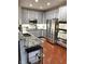 Modern kitchen featuring gray cabinets and stainless steel appliances at 9454 Tanhurst Dr, Indianapolis, IN 46250
