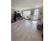 Sun-filled living area features new wood flooring, arched windows and neutral paint at 9454 Tanhurst Dr, Indianapolis, IN 46250