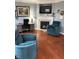Comfortable living room with hardwood floors, a fireplace, and cozy seating at 9454 Tanhurst Dr, Indianapolis, IN 46250