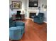 Spacious living room showcasing armchairs, desk, and fireplace at 9454 Tanhurst Dr, Indianapolis, IN 46250