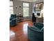 Bright living room featuring plush armchairs, a desk, and ample natural light at 9454 Tanhurst Dr, Indianapolis, IN 46250