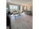 Sun-filled living area features new wood flooring, arched windows and neutral paint at 9454 Tanhurst Dr, Indianapolis, IN 46250