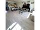 Open concept living area featuring new wood flooring, dining area and large windows at 9454 Tanhurst Dr, Indianapolis, IN 46250