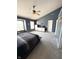 Primary bedroom with vaulted ceilings, ceiling fan and lots of closet space at 9454 Tanhurst Dr, Indianapolis, IN 46250