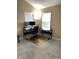An office featuring a wooden desk with dual monitors, and a modern ergonomic chair on top of an area rug at 9454 Tanhurst Dr, Indianapolis, IN 46250