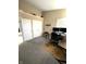 Home office featuring dual monitors on a wooden desk, and an ergonomic chair, with display space above the doors at 9454 Tanhurst Dr, Indianapolis, IN 46250