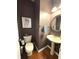 Charming powder room with pedestal sink and vintage-style decor at 9454 Tanhurst Dr, Indianapolis, IN 46250