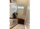Staircase leading to a front door with natural light and coat rack at 9454 Tanhurst Dr, Indianapolis, IN 46250