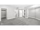 Unfinished basement featuring gray carpet, neutral walls, and access to a closet and bathroom at 11172 Cliffside Dr, Fortville, IN 46040