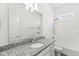Bright bathroom featuring granite countertop, white cabinets, and tile shower and bathtub combo at 11172 Cliffside Dr, Fortville, IN 46040