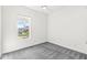 Bedroom with light-colored carpet and a window overlooking the neighborhood at 11172 Cliffside Dr, Fortville, IN 46040