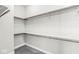 Walk-in closet with ample shelving and storage space for organization at 11172 Cliffside Dr, Fortville, IN 46040