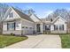 Charming single-Gathering home showcasing professional landscaping, a stone foundation, and inviting curb appeal at 11172 Cliffside Dr, Fortville, IN 46040