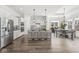 Modern kitchen with stainless steel appliances, a large island, pendant lighting, and a breakfast nook at 11172 Cliffside Dr, Fortville, IN 46040