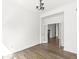 Open living room with hardwood floors and french doors leading to another room at 11172 Cliffside Dr, Fortville, IN 46040