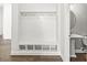 Mud room with storage bench, hooks, and a half bath with a pedestal sink at 11172 Cliffside Dr, Fortville, IN 46040