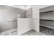 Tiled walk-in shower with glass enclosure and convenient access to the walk-in closet at 11172 Cliffside Dr, Fortville, IN 46040
