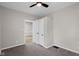 Bedroom with neutral paint, plush carpeting, a ceiling fan, and closet with a double door entrance at 1216 N Ewing St, Indianapolis, IN 46201