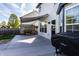 Wide back deck with a grill, awning, and a serene view of the lush green backyard at 1228 Knapps Ct, Greenwood, IN 46142