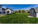 Expansive backyard featuring a shed, basketball court, and lush green lawn at 1228 Knapps Ct, Greenwood, IN 46142
