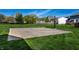 Spacious backyard with a basketball court and a lush lawn, perfect for outdoor activities at 1228 Knapps Ct, Greenwood, IN 46142