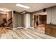 Spacious basement with light vinyl flooring, a home gym, and large cabinet at 1228 Knapps Ct, Greenwood, IN 46142