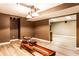 Finished basement space with modern lighting and space for workout equipment at 1228 Knapps Ct, Greenwood, IN 46142