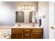 Bathroom features double sinks, a vanity with wood cabinets and neutral wall color at 1228 Knapps Ct, Greenwood, IN 46142