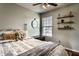 Comfortable bedroom featuring a plush bed, soft lighting, and decorative shelves at 1228 Knapps Ct, Greenwood, IN 46142