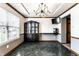 Dining room featuring black display cabinet, modern lighting, and a TV on the wall at 1228 Knapps Ct, Greenwood, IN 46142
