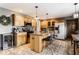 Spacious kitchen with wooden cabinetry, granite countertops, stainless steel appliances, and a tile backsplash at 1228 Knapps Ct, Greenwood, IN 46142
