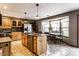 Updated kitchen featuring granite countertops, stainless steel appliances, and an adjacent dining area with many windows at 1228 Knapps Ct, Greenwood, IN 46142