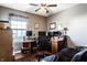 Cozy home office space with a ceiling fan and dark wood floors at 1228 Knapps Ct, Greenwood, IN 46142