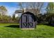 Well-maintained backyard shed with ample storage space and a lush green lawn at 1228 Knapps Ct, Greenwood, IN 46142