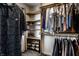 Spacious walk-in closet with built-in shelving and rods for hanging clothes and storing shoes at 1228 Knapps Ct, Greenwood, IN 46142