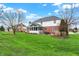 Large, well-maintained backyard with mature trees, plus patio and screened-in porch at 13225 Snow Owl Dr, Carmel, IN 46033