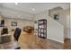 Finished basement area with hardwood floors, staircase, sofa and a dark wood bookcase at 13225 Snow Owl Dr, Carmel, IN 46033