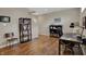 Basement with hardwood floors, staircase and dark wood bookcase at 13225 Snow Owl Dr, Carmel, IN 46033