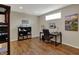 Finished basement with hardwood floors, small window and desk at 13225 Snow Owl Dr, Carmel, IN 46033