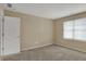 Bedroom with neutral walls featuring carpet and a window for natural light at 13225 Snow Owl Dr, Carmel, IN 46033