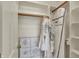 Walk-in closet with white shelving, hanging rods, and decorative tile flooring at 13225 Snow Owl Dr, Carmel, IN 46033