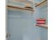 Closet space featuring carpet, white shelving, and wooden rods at 13225 Snow Owl Dr, Carmel, IN 46033