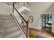 Grand foyer with staircase, hardwood floors, high ceilings, and ample natural light at 13225 Snow Owl Dr, Carmel, IN 46033