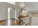 Elegant foyer with hardwood floors, a staircase, and a bright, inviting entrance at 13225 Snow Owl Dr, Carmel, IN 46033