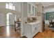 Charming hallway with access to the kitchen with stainless steel appliances at 13225 Snow Owl Dr, Carmel, IN 46033