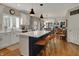 Spacious kitchen with island seating, modern appliances, and an open floor plan at 13225 Snow Owl Dr, Carmel, IN 46033