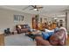 Cozy living room with hardwood floors, comfortable seating, and easy access to the kitchen and dining spaces at 13225 Snow Owl Dr, Carmel, IN 46033