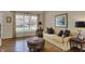Inviting living room features hardwood floors, large window, and natural light at 13225 Snow Owl Dr, Carmel, IN 46033