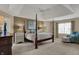 Spacious main bedroom boasts a tray ceiling and plenty of natural light at 13225 Snow Owl Dr, Carmel, IN 46033